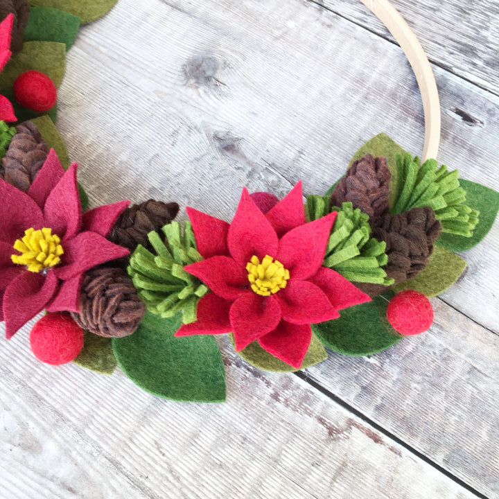 The Handmade Florist Woodland Wonders felt flower wreath kit with poinsettias and pine cones