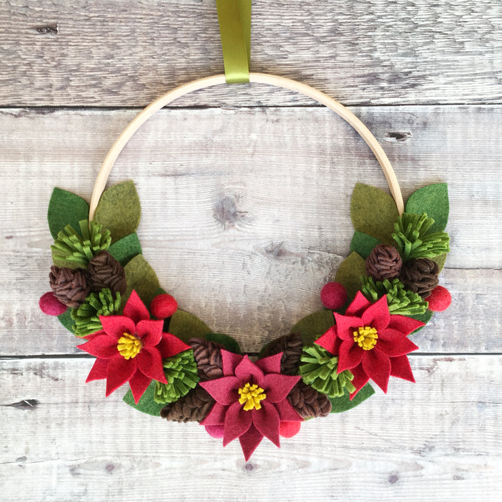 The Handmade Florist Woodland Wonders felt flower wreath kit with poinsettias and pine cones