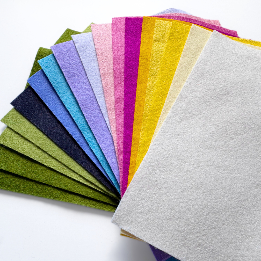 Colourful wool-blend felt sheets arranged in a fan shape on a white background