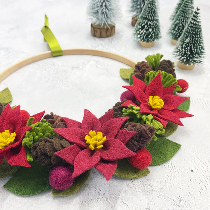 The Handmade Florist Woodland Wonders felt flower wreath kit with poinsettias and pine cones